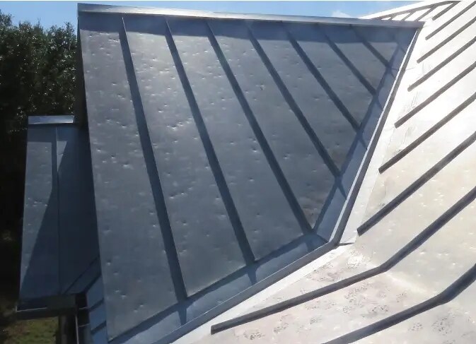 Hail denting on standing seam metal roof panel