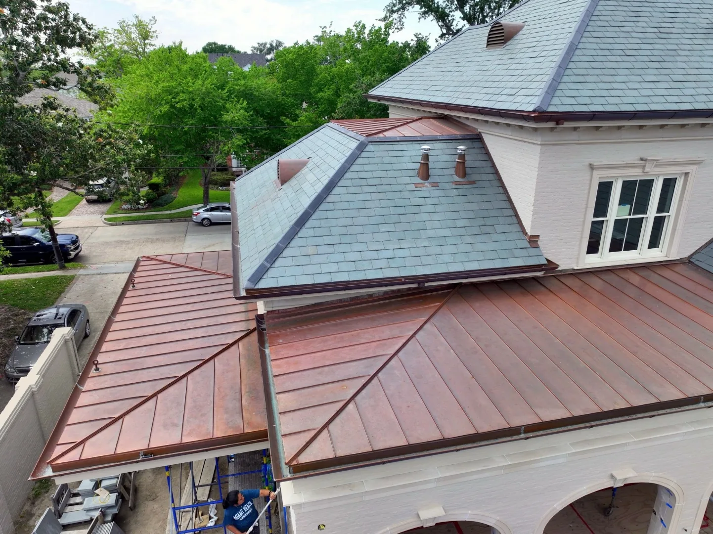 Copper standing seam and blue-gray slate roof on luxury Colorado home