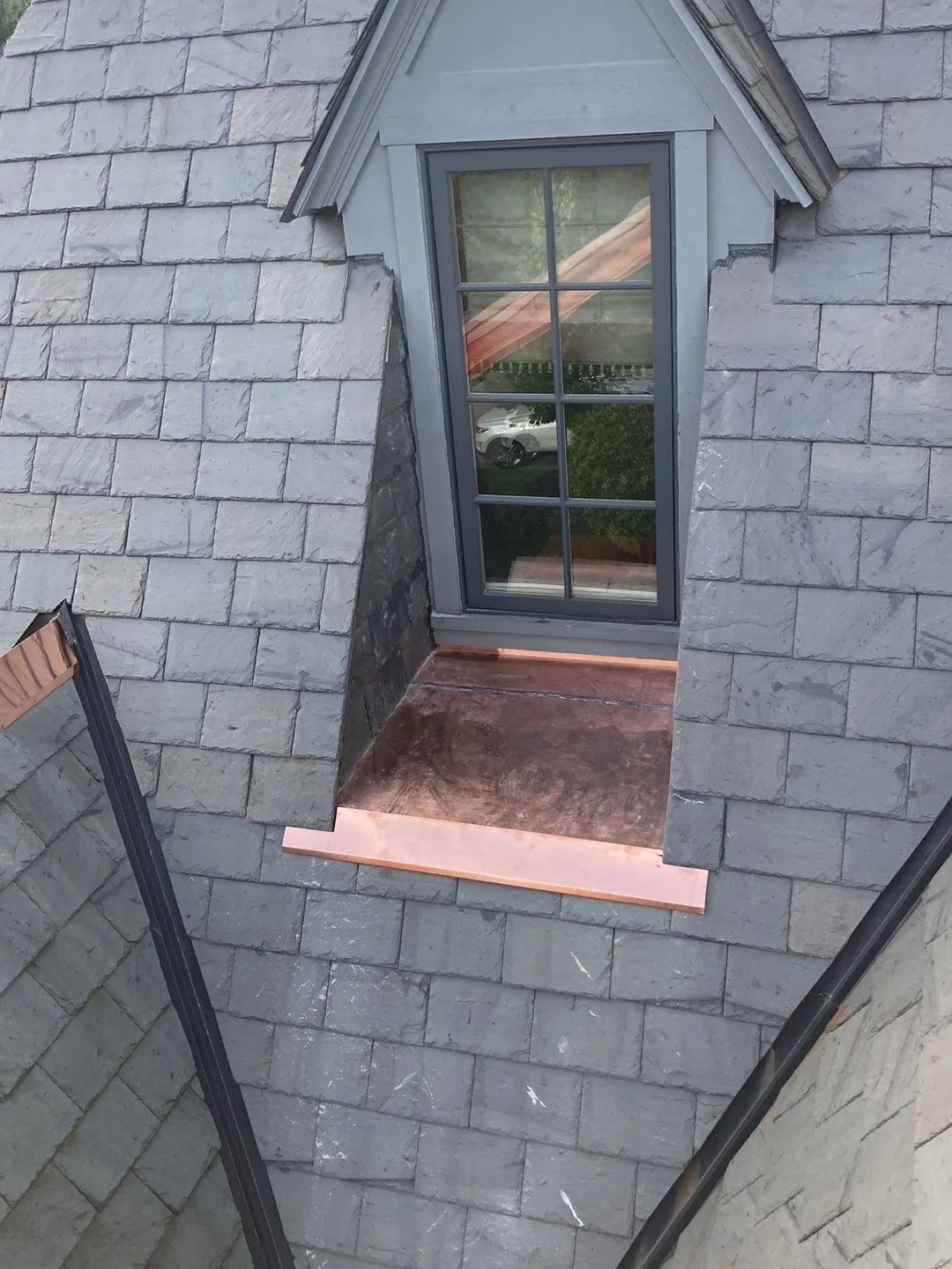 Close-up slate with copper dormer flashing detail - premium craftsmanship by Impact Exteriors