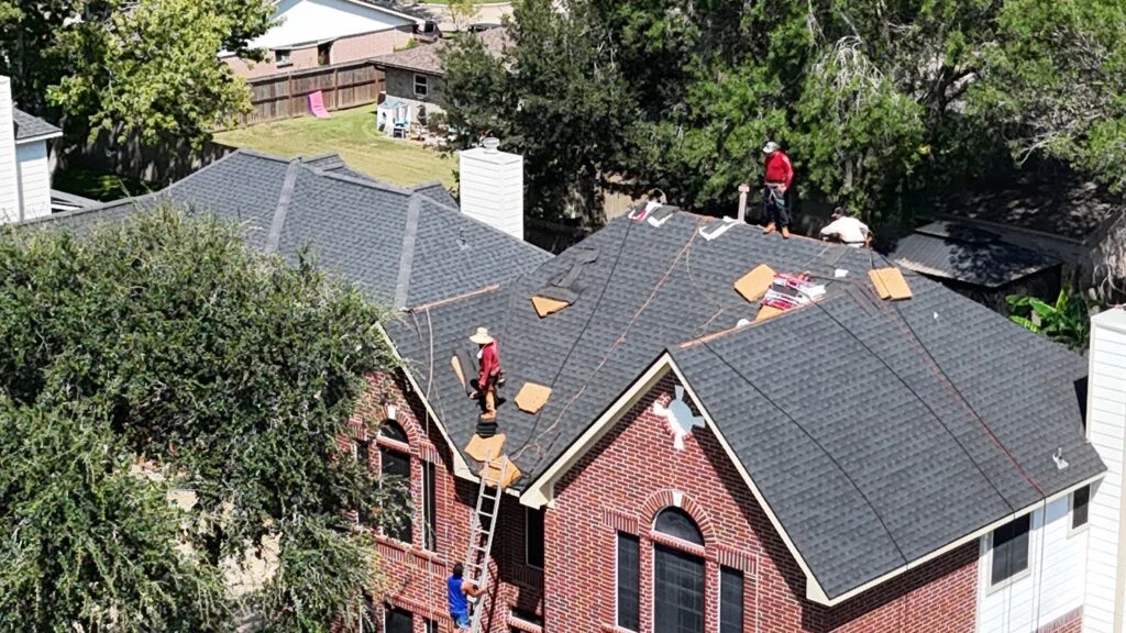 Impact Exteriors crew installing residential roof